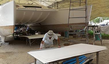 With the bimini under Ocelot, Jon straightens nonskid edges