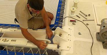 Jon mounting the big chain rollers in the anchor platform