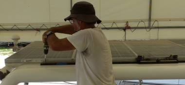 Jon bolting the main-sheet track to the top of the targa-bar