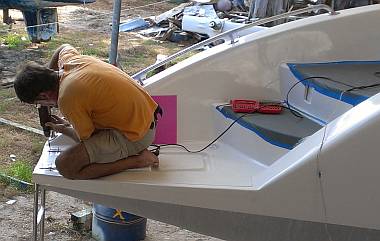 Jon mounting the portside swim ladder to the transom