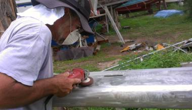 Jon & his new polishing pad, working scratches out of the mast