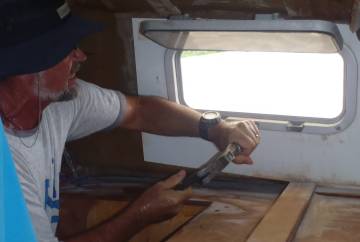 Jon removing screws from our forward hatches