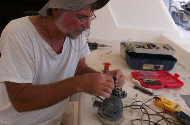 Dr. Jon performing surgery to resurrect a palm sander