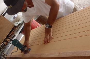 Jon cutting slots in the foam to make it bend more easily