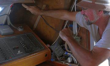 Jon pulling transducer wires to the nav-station