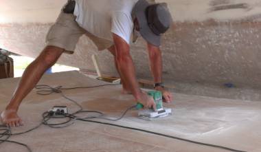 Jon, bum's up, sanding the underside of the bimini smooth