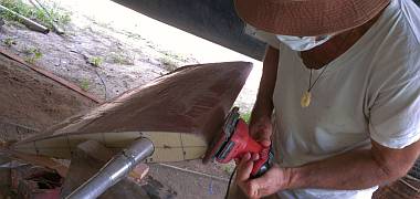 Jon sanding the new shape into the rudder