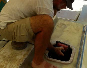 Jon sanding the glass over the hatch mounting rims