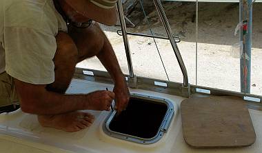 Jon marking out where to drill the mounting holes for a hatch