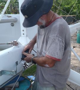 Jon grinds off rivets from mast steps