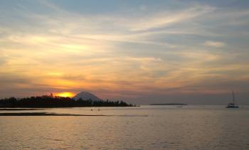 Ocelot anchored in a swirling Kina Badjo sunset