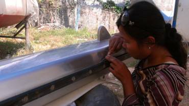 Kit, Boy's pretty wife, doing meticulous detail work on the mast