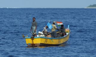 Indian fishermen use nets & flags with floats.