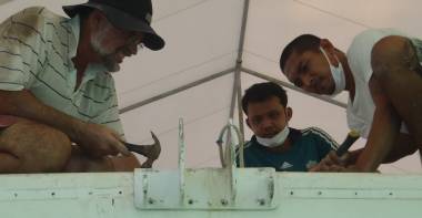 Jon, Boy, & Golf work on the anchor support mounting plate