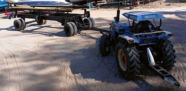 The boatyard's catamaran trailer & one of their 2 tractors