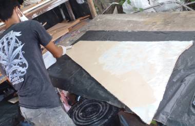 Max glassing a foam panel for the foredeck