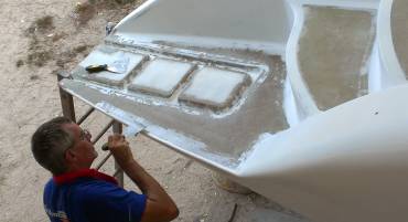 Mike (AME) applying epoxy filler to the port sugar-scoop