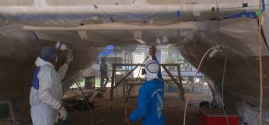 Mike and P'Wat dueling with spray guns under the bridge-deck