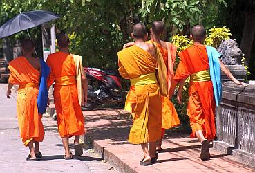 Robed monks are very colorful in the noonday sun
