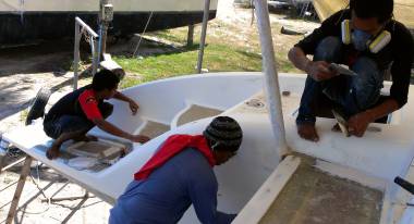 Nut checking for pin-holes while Yoong & Baw build the aft-deck