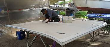 Pla sanding the bimini, preparing it for a final gelcoat spray