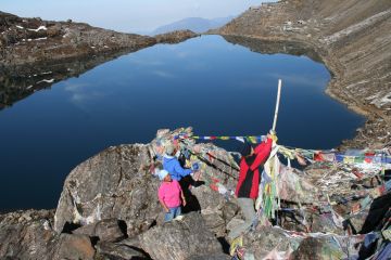 Hanging prayer flags above Gosainkund Lake