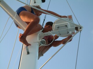 My dad and sister installing the radar antenna on the first spreader of our mast