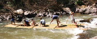 Jon & our guide madly poling through the rapids. Fun!