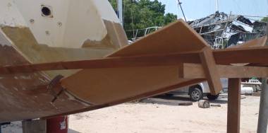 First bit of foam epoxied to our starboard transom