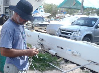 Tying on nylon cord so we can pull out the Main Halyard