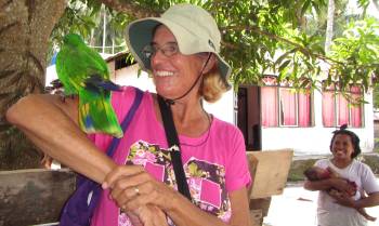 Sue with an Eclectus parrot friend