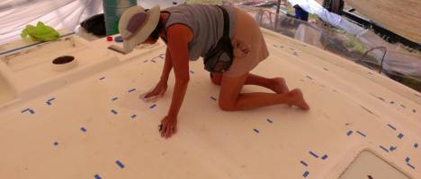 Sue cleaning the top with Acetone, the tape shows Mike where to spray