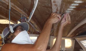 Sue removing plugs from Jon's de-coring holes in the salon