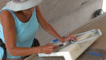 Sue cleaning up yet another of our 17+ hatches