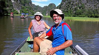 Floating through rice paddies under karst mountains