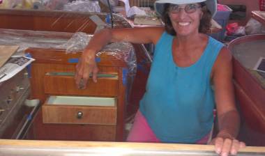 The happy cook in her newly rebuilt galley - new drawer open