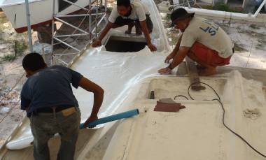 Max, Boy, and Jon test the fit of the final big glass sheets