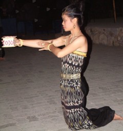 A Timorese dancer offers the "welcome box"