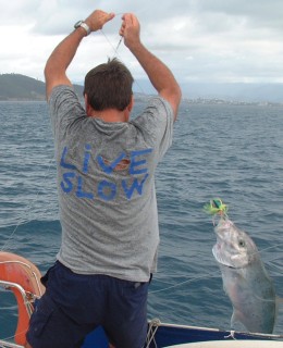 Jon and Amanda land a trevally off New Caledonia