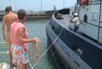 Tying to the tug in the Canal lock