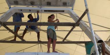 Amanda & the guys on scaffolding, masking the targa-bar