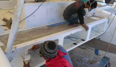 Yoong and Baw building up the ground-off parts of the aft-deck