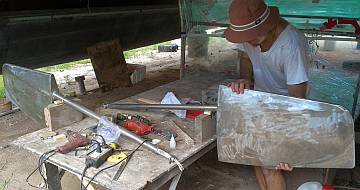 Jon's setup for working on the rudders, under a nearby cat